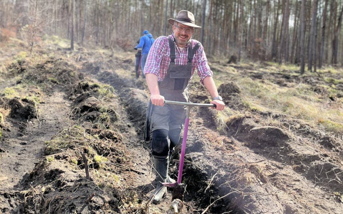 man with shovel on acre